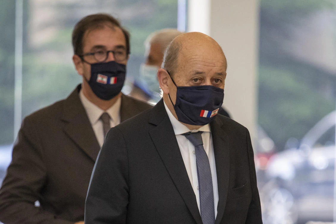 French Foreign Minister Jean-Yves Le Drian, wearing a mask to help prevent the spread of the coronavirus, arrives to meet Lebanese president Michel Aoun at the Presidential Palace in Baabda, east of Beirut, Lebanon, Thursday, July 23, 2020. (AP)
