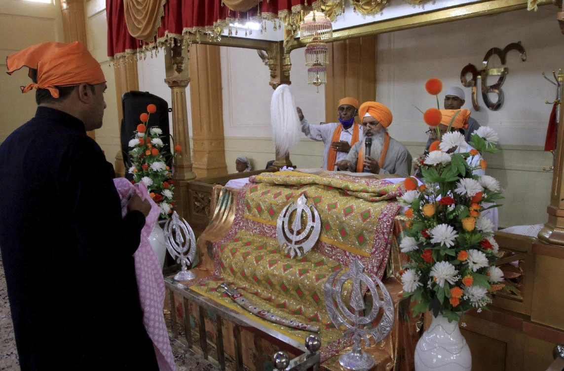 People of the Sikh community take part in worship at the Gurudawara Sri Guru Singh Sabha temple in Quetta, Pakistan, Thursday, July 23, 2020. (AP)