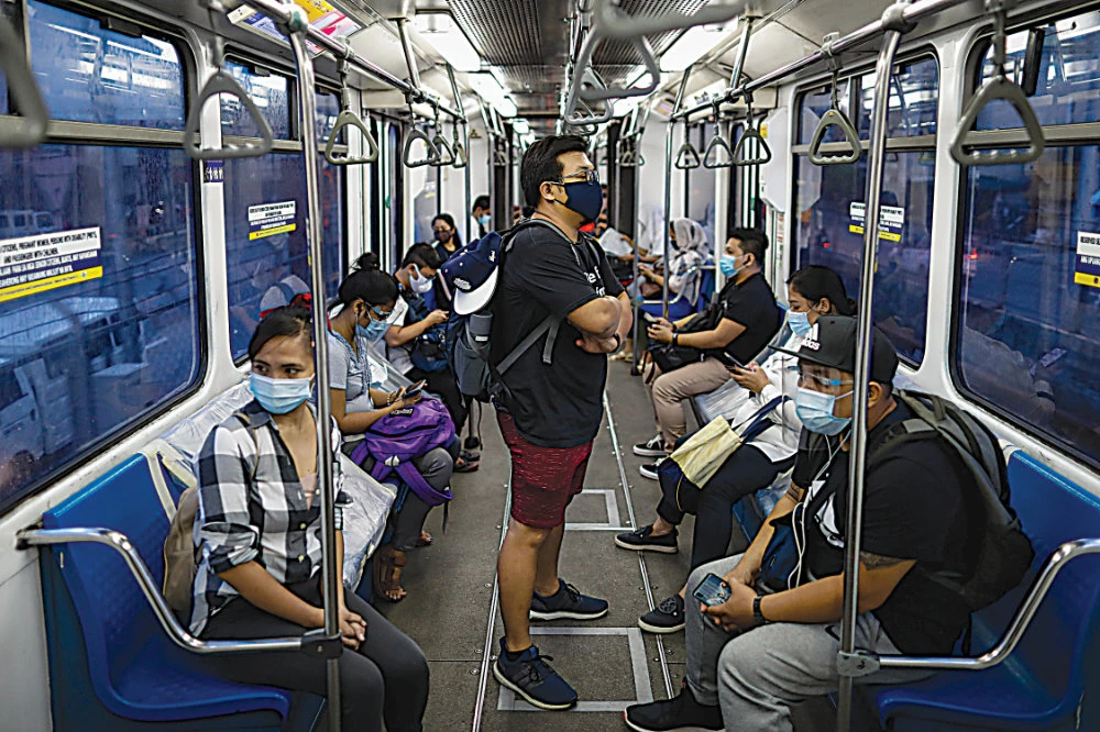 As the Philippine government gradually re-opens the economy it has begun to allow workers to slowly start to travel overseas again. (Reuters)