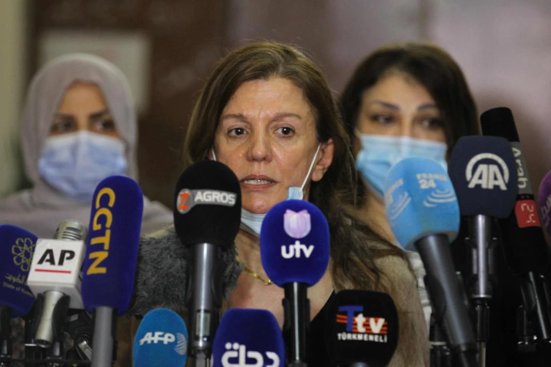 Dhikra Sarsam speaks during a press conference in Baghdad on July 21, 2020, demanding the release of her German friend Hella Mewis who was kidnapped the previous day. (AFP)