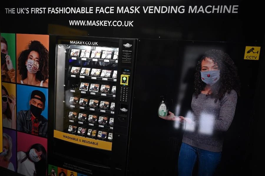 A vending machine dispensing face coverings is pictured in Carnaby Street, central London, on July 23, 2020, as lockdown restrictions continue to be eased during the novel coronavirus COVID-19 pandemic. (AFP)