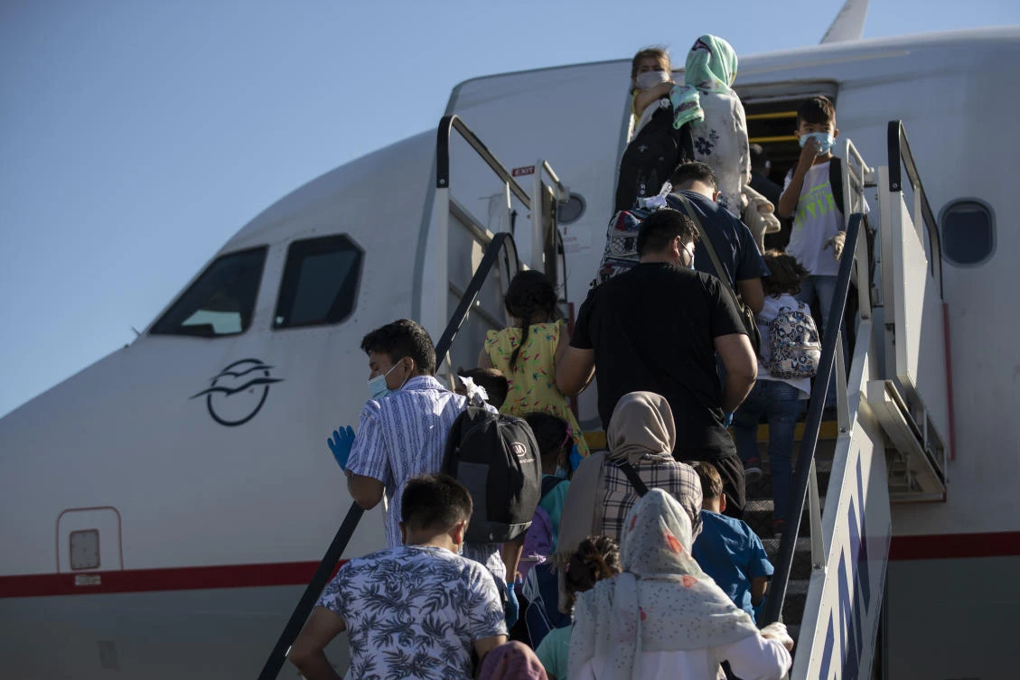 A group of migrant children with health issues board a plane bound for Germany, at Athens International Airport, on Friday, July 24, 2020. (AP Photo)