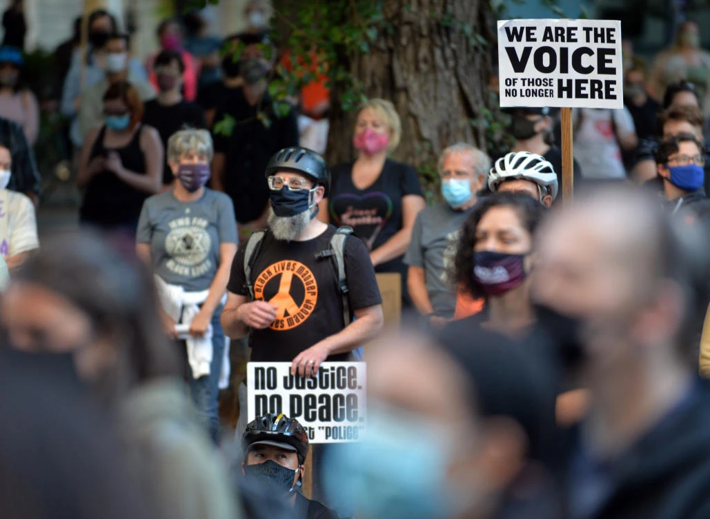 Demonstrators protest in front of the Multnomah County Justice Center in Portland, Oregon, on July 23, 2020. (AFP)