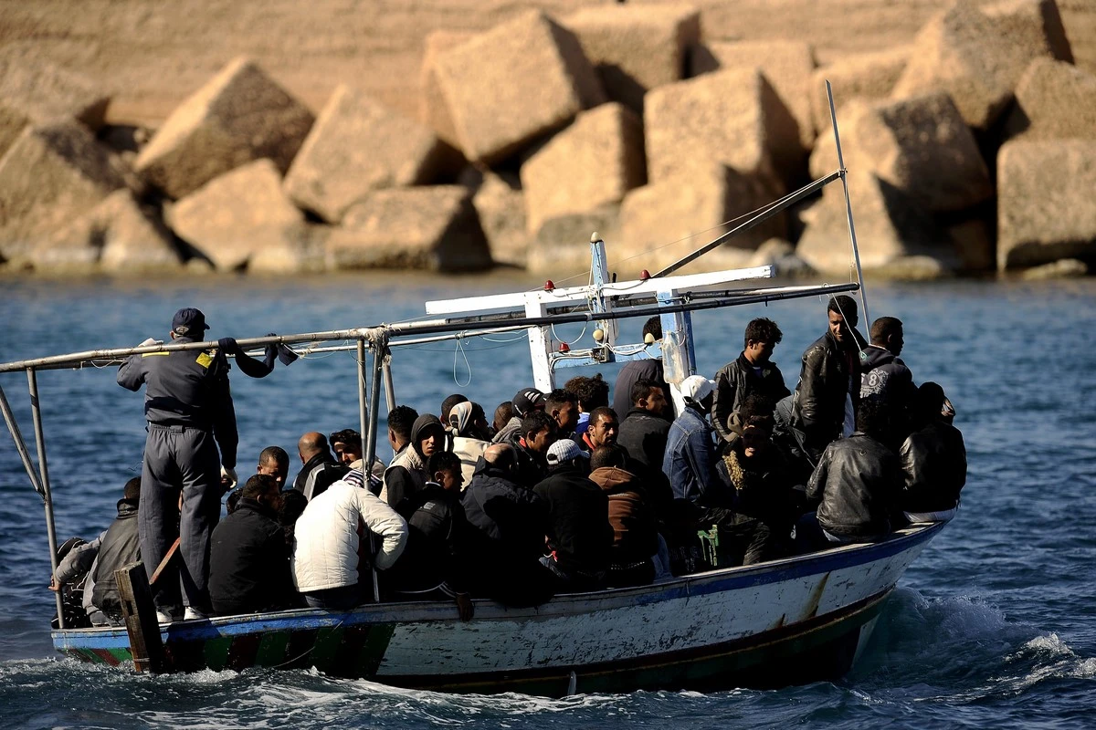 Migrants from Tunisia arriving on the Italian island of Lampedusa in the middle of the Mediterranean. (AFP/File Photo)