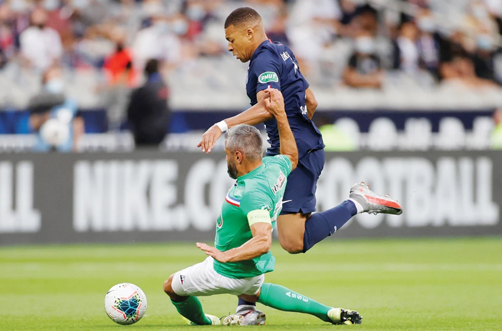 Paris Saint-Germain’s 21-year-old star Kylian Mbappe sustained an injury on Friday from this challenge. (Reuters)