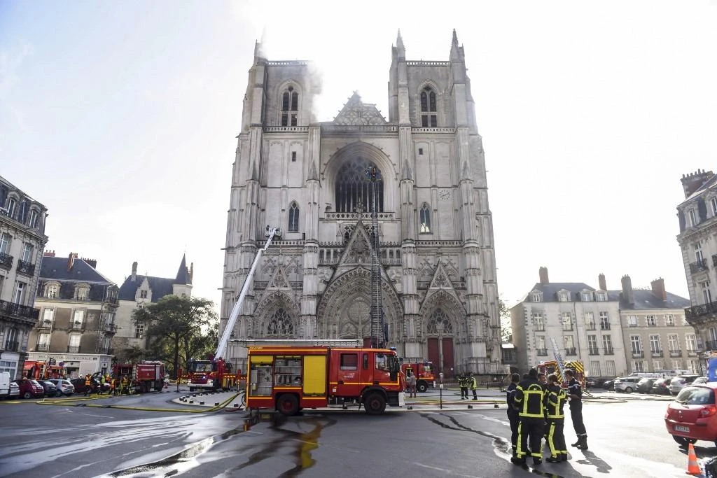 Firefighters put out a fire at the Cathedral of St. Peter and St. Paul of the western French city of Nantes on July 18, 2020. (AFP)