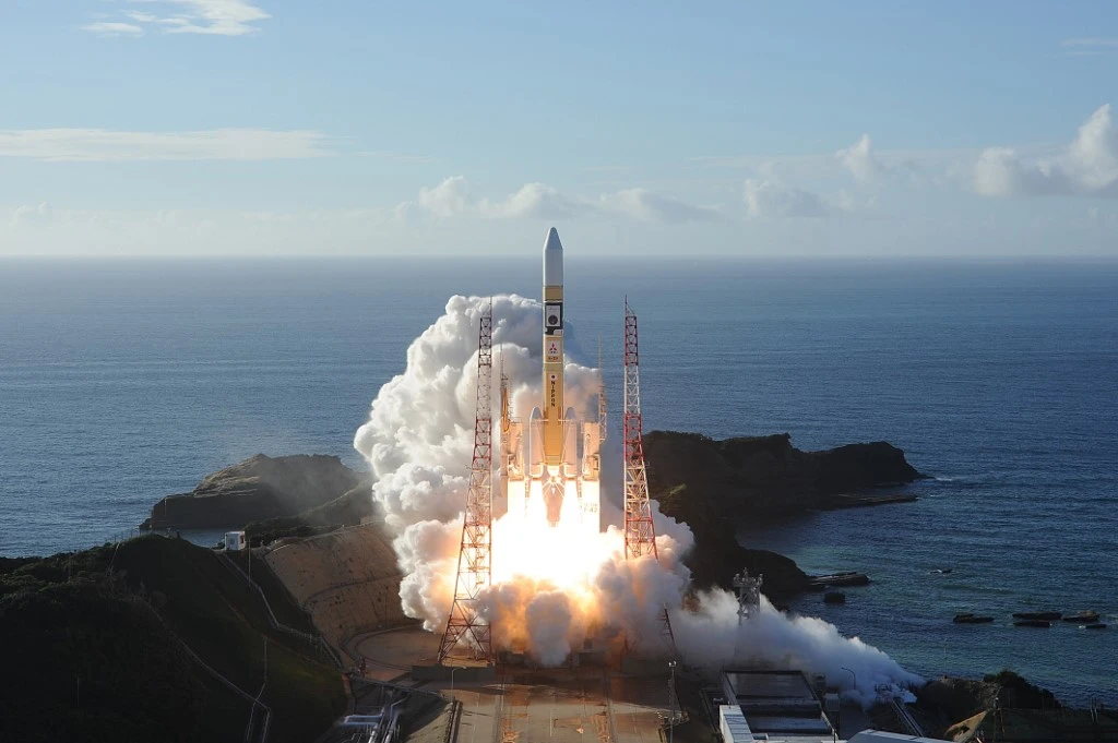 Above, an H-2A rocket carrying the Amal probe blasts off from Tanegashima Space Center in southwestern Japan. (Mitsubishi Heavy Industries/AFP)