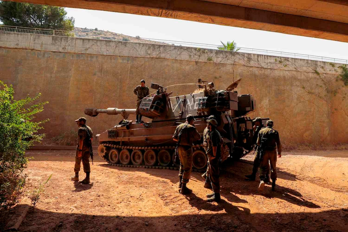 Israeli soldiers gather near Moshav Sde Eliezer, in northern Israel along the border with Lebanon on July 26, 2020. (AFP)