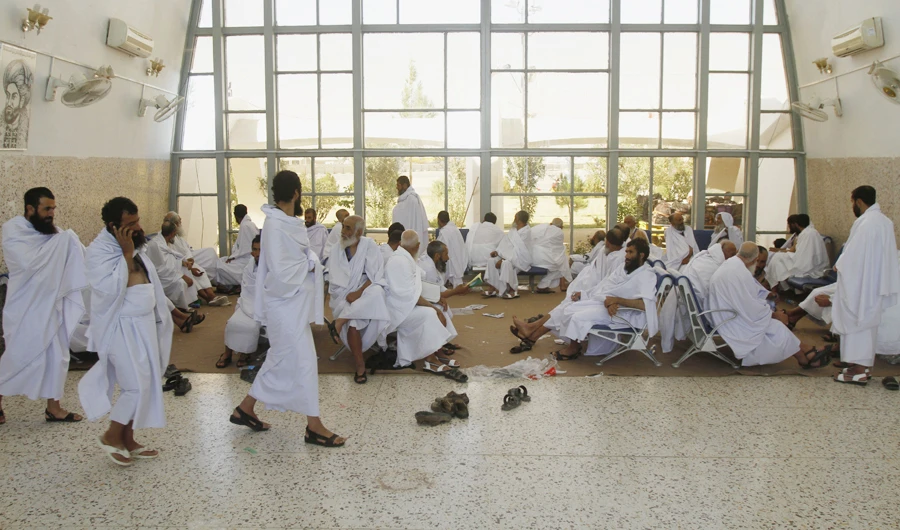 Afghan pilgrims wait for their flight for Makkah, Saudi Arabia, to perform pilgrimage, in Kandahar, Afghanistan, Sunday, Sept. 13, 2015. (AP)
