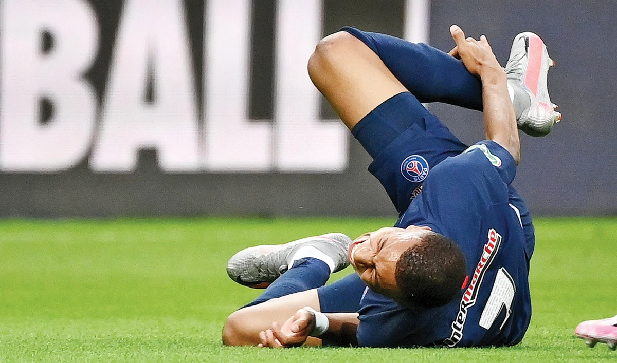 PSG’s French forward Kylian Mbappe after an injury during the French Cup final against Saint-Etienne on Friday at the Stade de France in Saint-Denis, outside Paris. (AFP)