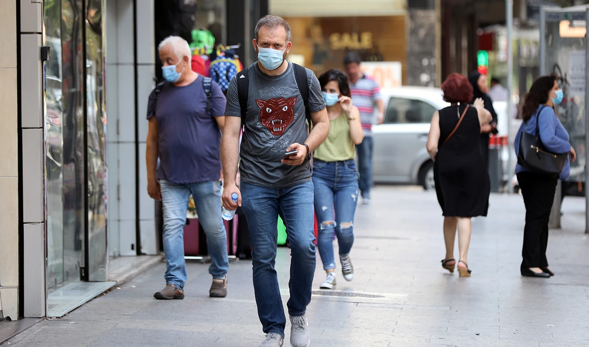 People walk as they wear face masks to prevent the spread of the coronavirus disease (COVID-19) in Beirut, Lebanon July 28, 2020. (Reuters)