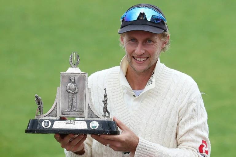 England captain Joe Root holds the Wisden Trophy following his side's 2-1 Test series victory over the West Indies Martin Rickett. (AFP)