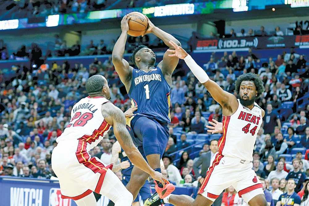 In a twinbill to launch the restart, Zion Williamson (1) and the New Orleans Pelicans battle the Utah Jazz while the Lakers and Clippers face off in the Los Angeles derby. (AP file photo)