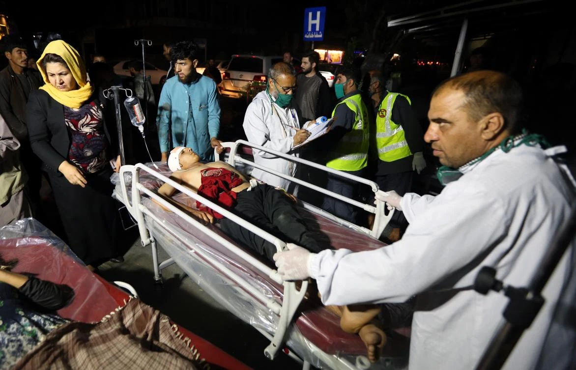A wounded child is carried into the Emergency Surgical Center in Kabul after a bomb blast targeted a crowded market a day before Eid Al-Adha in Logar province, Afghanistan, 30 July, 2020. (EPA)