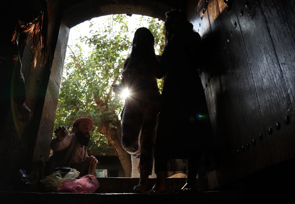 Above, Iraqi Yazidis visit the Temple of Lalish in a valley near the Kurdish city of Dohuk on August 2, 2019. (AFP)