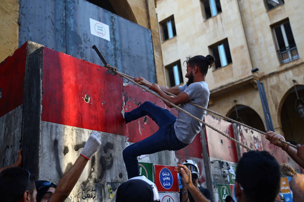 Demonstrators take part in anti-government protests that have been ignited by a massive explosion in Beirut, Lebanon August 10. (Reuters)