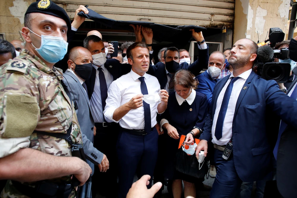 French President Emmanuel Macron gestures as he visits a devastated street of Beirut, Lebanon August 6, 2020. (Reuters)