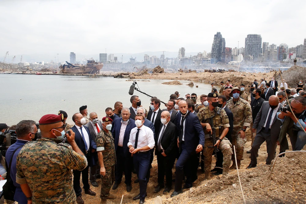 French President Emmanuel Macron visits the devastated site of the explosion at the port of Beirut. (Reuters)
