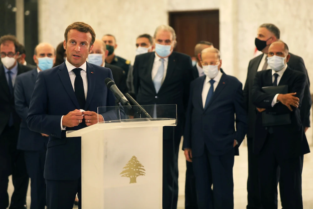 French President Emmanuel Macron gestures as he speaks at a press conference following Tuesday's blast in Beirut's port area, at the presidential palace in Baabda. (Reuters)