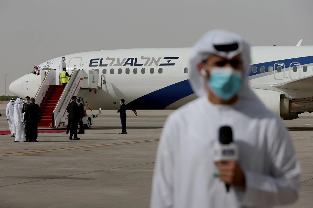 A member of the media reports after the Israeli flag carrier El Al's airliner carrying Israeli and U.S. delegates landed at Abu Dhabi International Airport, in Abu Dhabi, United Arab Emirates August 31, 2020. (Reuters/Christopher Pike)