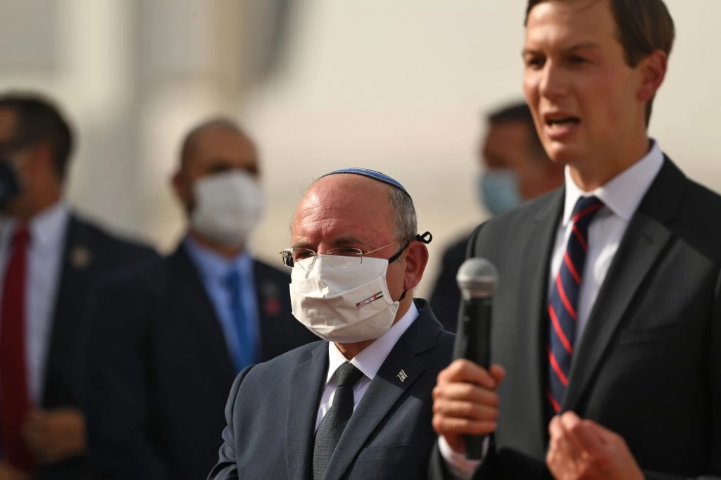 US Presidential Adviser Jared Kushner, right, speaks as he stands next to the Head of Israel’s National Security Council Meir Ben-Shabbat at the Abu Dhabi airport on August 31, 2020. (AFP)