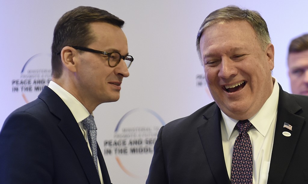 Poland's PM Mateusz Morawiecki and US Secretary of State Mike Pompeo share a smile as they attend a conference in Warsaw. (File/AFP)