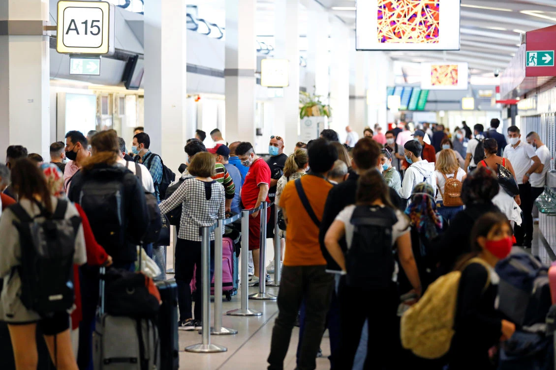 Travelers are seen at the Tegel airport, as the spread of the coronavirus disease (COVID-19) continues, in Berlin, Germany, July 29, 2020. (Reuters)