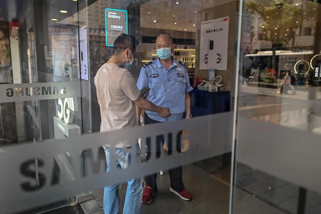 Companies are rethinking their production and supply chains amid rising Chinese labor costs. Above, a Samsung retail store in Wuhan. (AFP file photo)