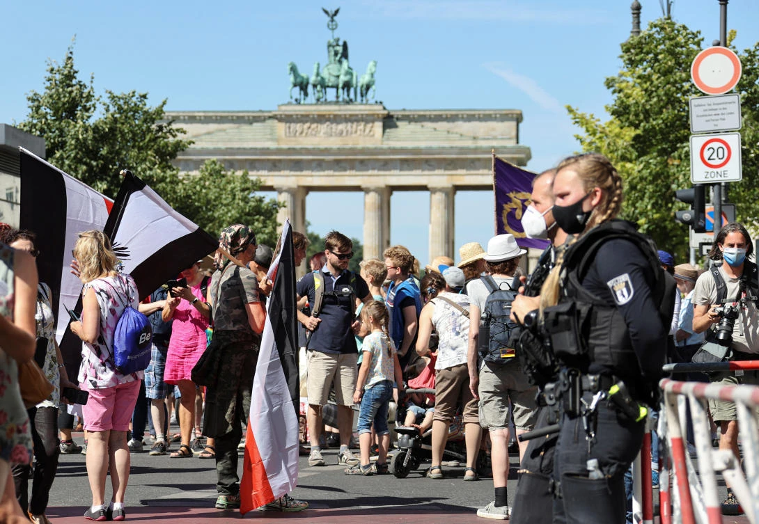 Demonstrators attend a protest against the government's restrictions amid the coronavirus disease (COVID-19) outbreak, at the Brandenburg Gate, in Berlin, Germany, August 1, 2020. (Reuters)