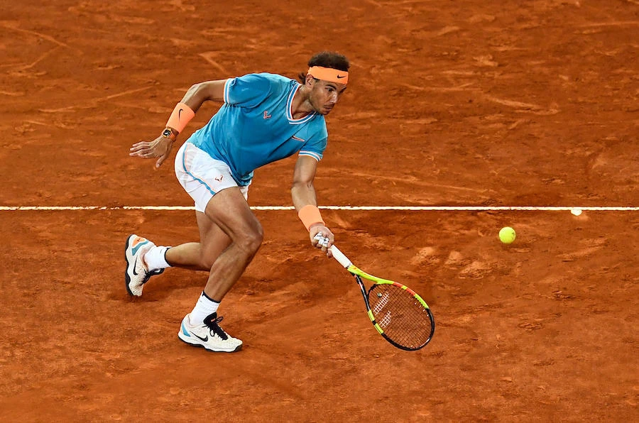 Spain's Rafael Nadal returns the ball to Switzerland's Stan Wawrinka during their ATP Madrid Open quarter-final tennis match at the Caja Magica in Madrid on May 10, 2019. (File/AFP)