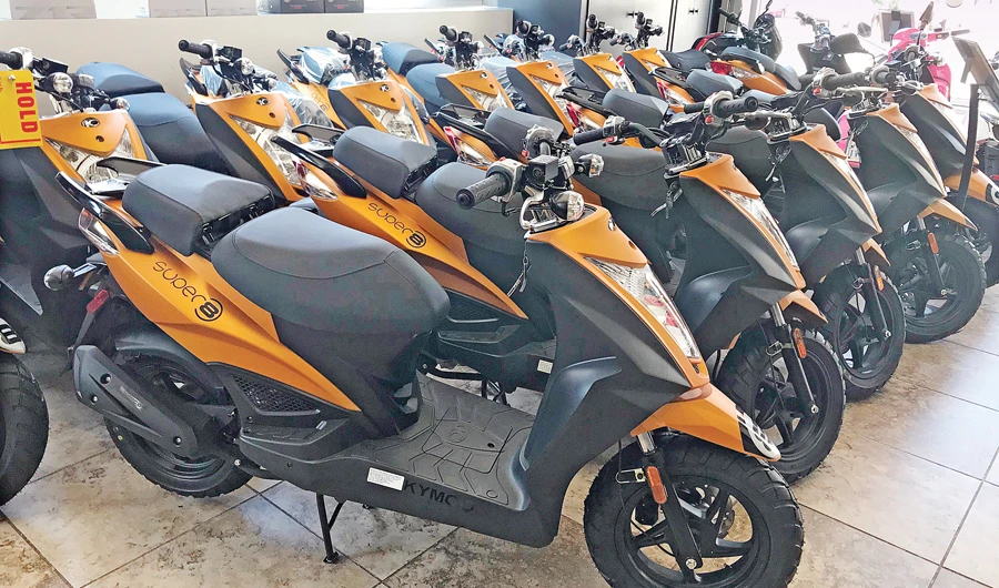 Scooters are seen at a shop in New York. Residents are turning to the turquoise-blue rental mopeds of ride sharing company Revel in huge numbers. (AFP)