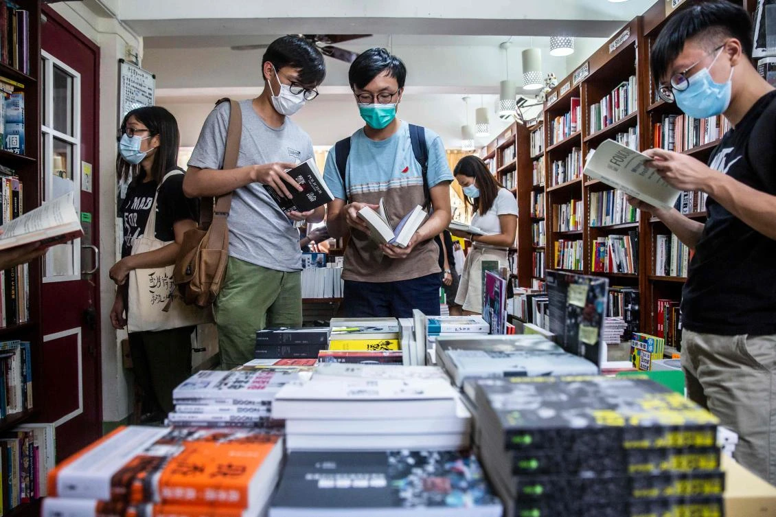 Above, customers browse in a bookstore in Hong Kong that stocks books with sensitive political titles that could potentially contravene the new national security law. (AFP)