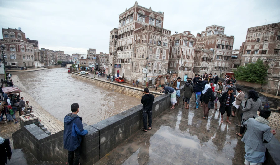 People look at the rising water level of floodwater during heavy rains in the old quarter of Sanaa, Yemen April 20, 2020. (REUTERS)