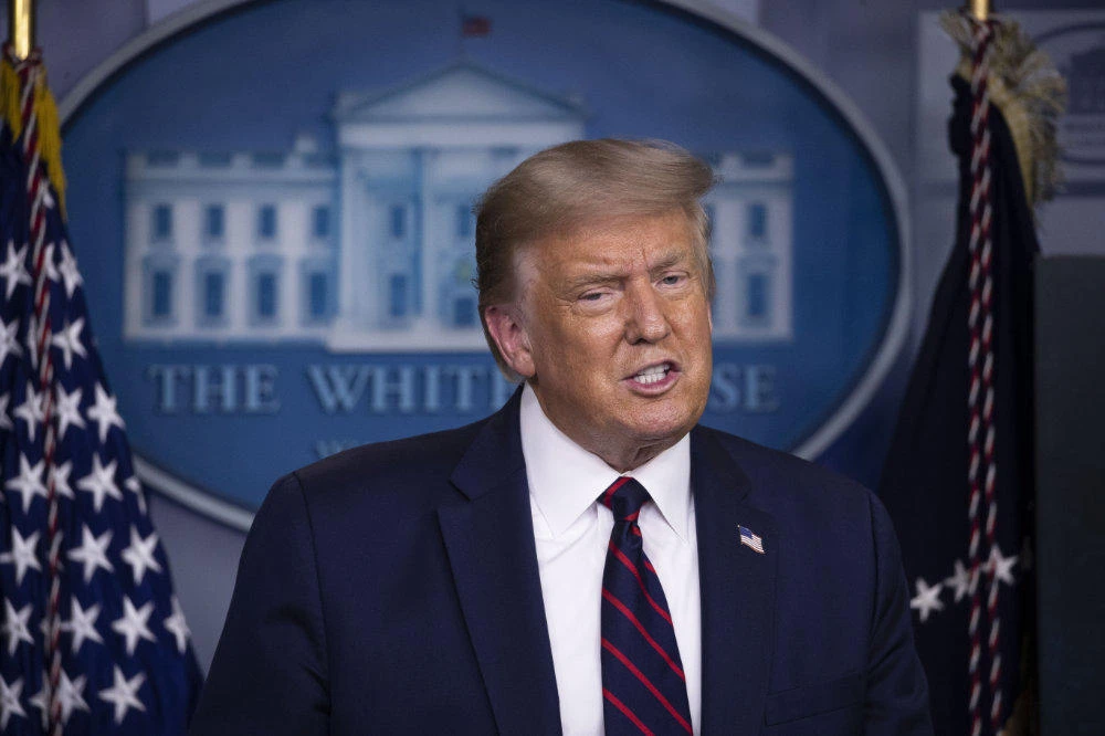 President Donald Trump speaks during a briefing with reporters at the White House on Aug. 4, 2020, in Washington. (AP Photo/Alex Brandon)