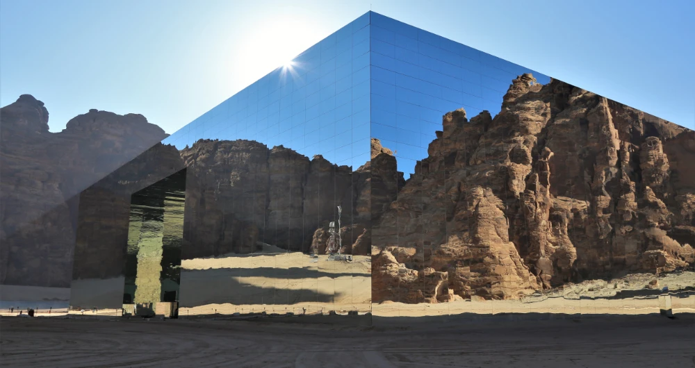 The cube-shaped structure is covered in 9,740 square meters of mirrors that reflect the breathtaking surrounding landscape. (Supplied)
