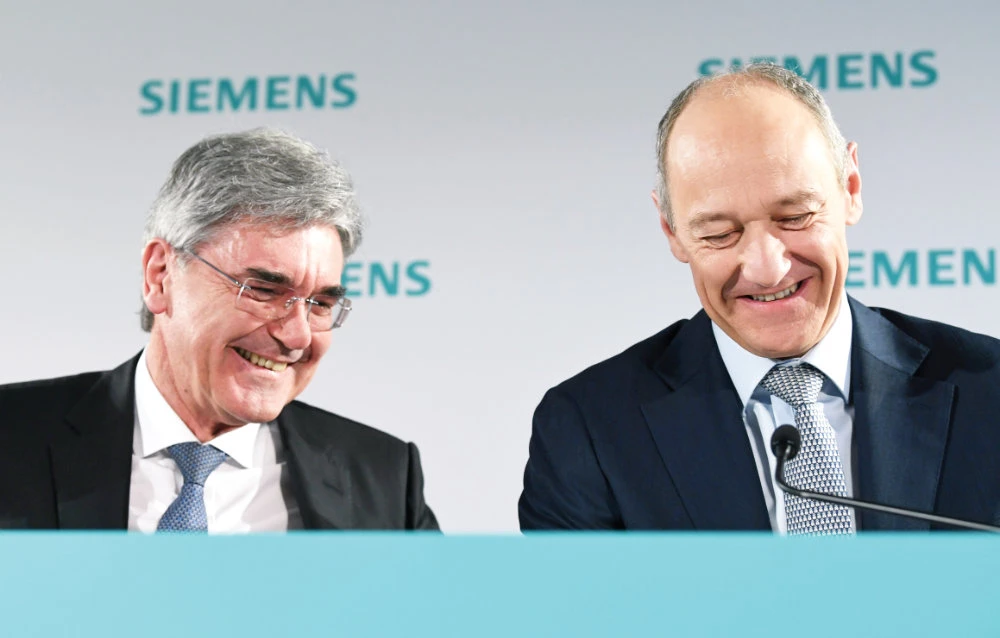 Siemens CEO Joe Kaeser and deputy CEO Roland Busch said the German engineering group’s strong showing came despite factory shutdowns. (Reuters)