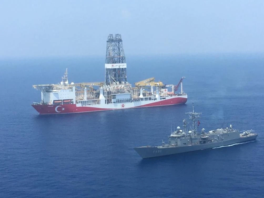 Above, Turkey’s drilling ship Fatih is escorted by a Turkish Navy warship on July 9,2019 while on its way to the eastern Mediterranean near Cyprus. (Turkish Defense Ministry/AFP)