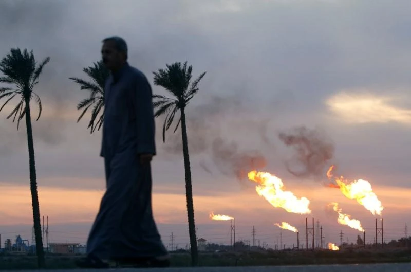 Flames emerge from flare stacks at the oil fields in Basra, Iraq, January 17, 2017. (Reuters)