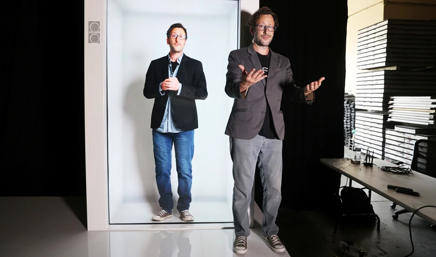 Inventor David Nussbaum next to a life-size hologram of himself. (Reuters)