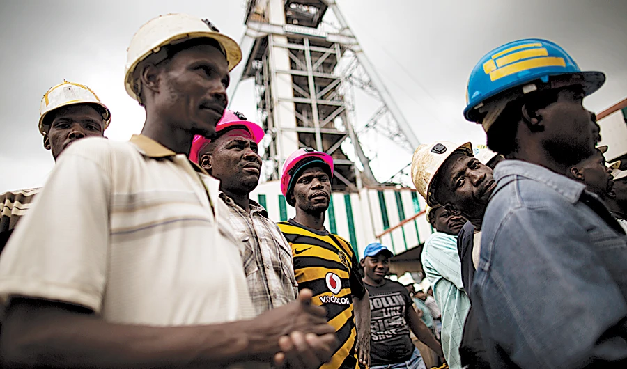 Soaring gold prices are helping mining companies to cut debt with many seeing a jump in revenues and healthy dividends on the horizon. (AFP)