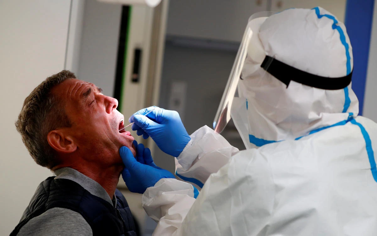 A traveler returned from the Ukraine receives a voluntary coronavirus disease (COVID-19) test by the German Red Cross at the new Corona test station of the central bus location in Berlin, Germany, August 5, 2020. (Reuters)