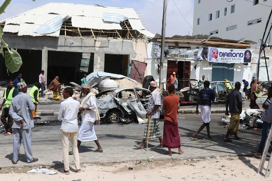 People gather at the site where a car bomb exploded near the Somali parliament in Mogadishu, Somalia, on January 8, 2020. (File/AFP)