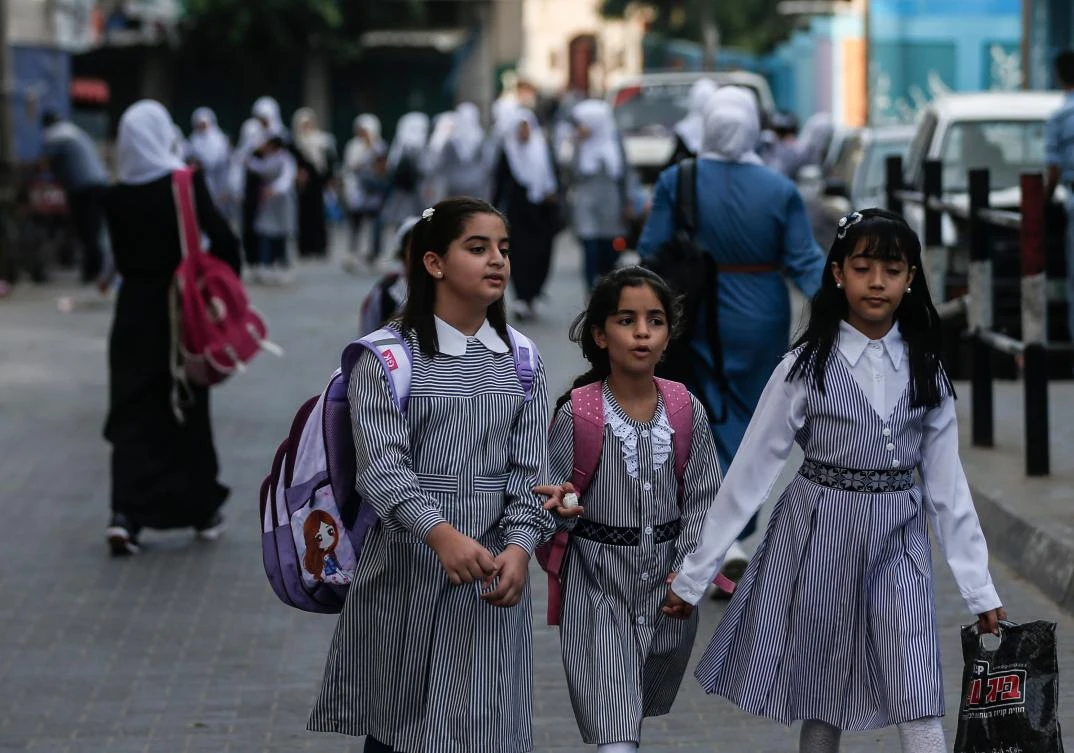 Palestinian student arrive at a school run by The United Nations Relief and Works Agency (UNRWA) in Jabalia refugee camp in northern Gaza Strip on August 8, 2020. (AFP)