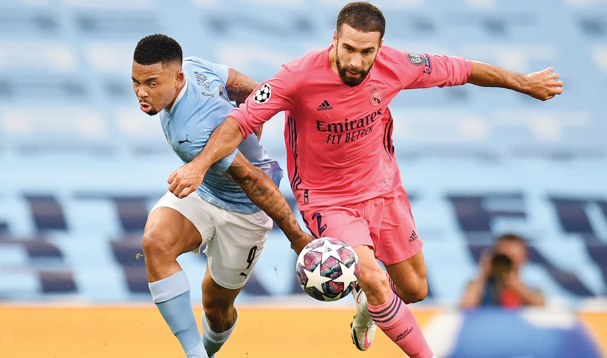Gabriel Jesus vies for the ball with Real Madrid’s Dani Carvajal during the Champions League match at the Etihad Stadium in Manchester, England. (AP)