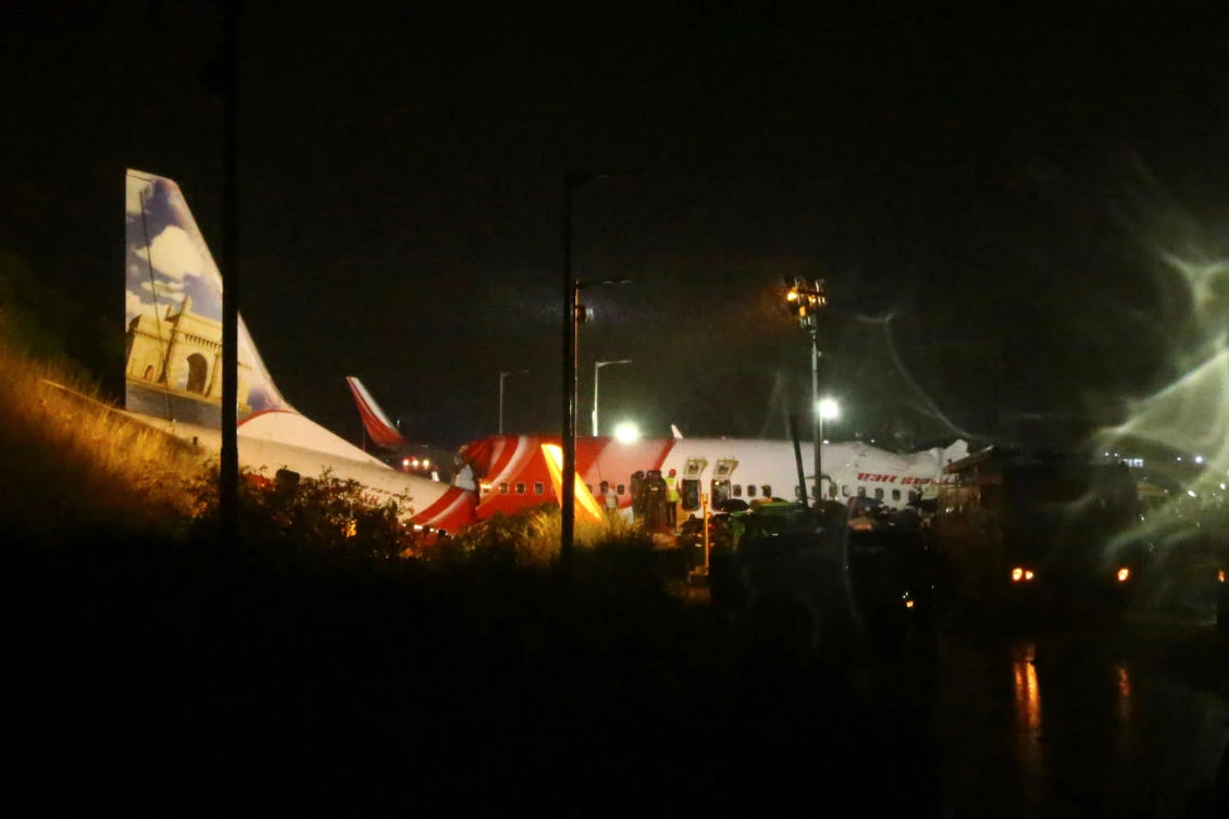 Rescue workers look for survivors after an Air India Express passenger plane crashed when it overshot the runway at the Calicut International Airport August 7, 2020. (Reuters)