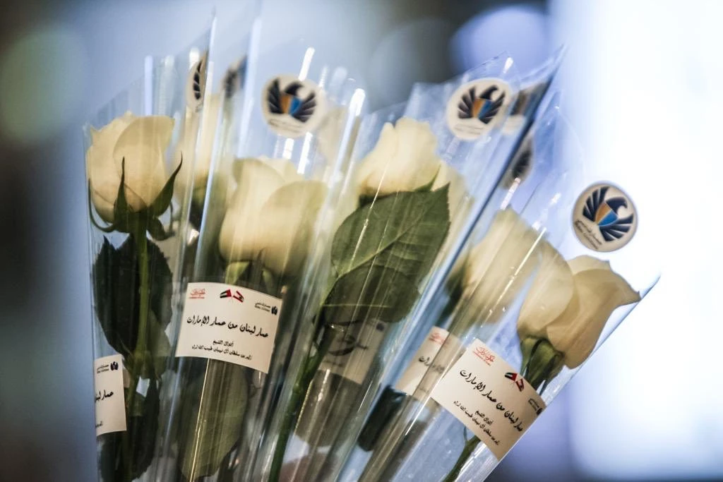 White roses were handed to passengers arriving from Beirut at Terminal 3 of Dubai International Airport. (Dubai Airport)