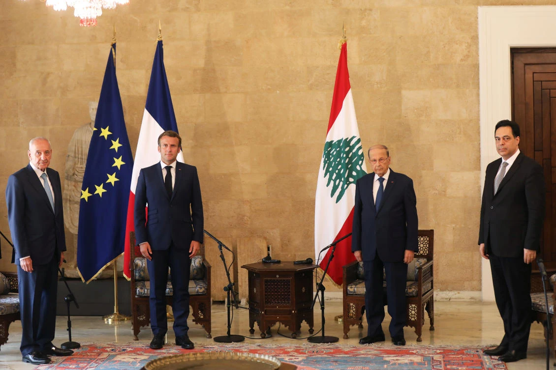 Lebanese Speaker of the Parliament Nabih Berri, President Macron, President Aoun and Lebanese PM Hassan Diab, pose for a picture during their meeting following Tuesday's blast in Beirut's port area, at the presidential palace in Baabda, Lebanon August 6, 2020. (Reuters)