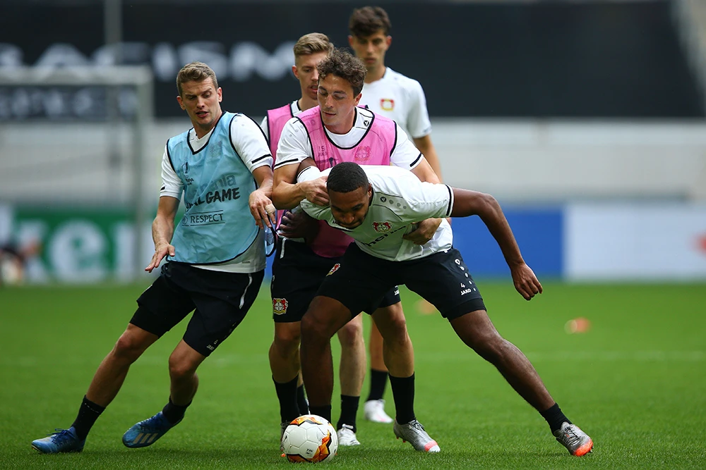 Leverkusen’s defender Jonathan Tah, right, and his teammates during a training session on the eve of the Europa League quarterfinal match against Inter Milan. (AFP)