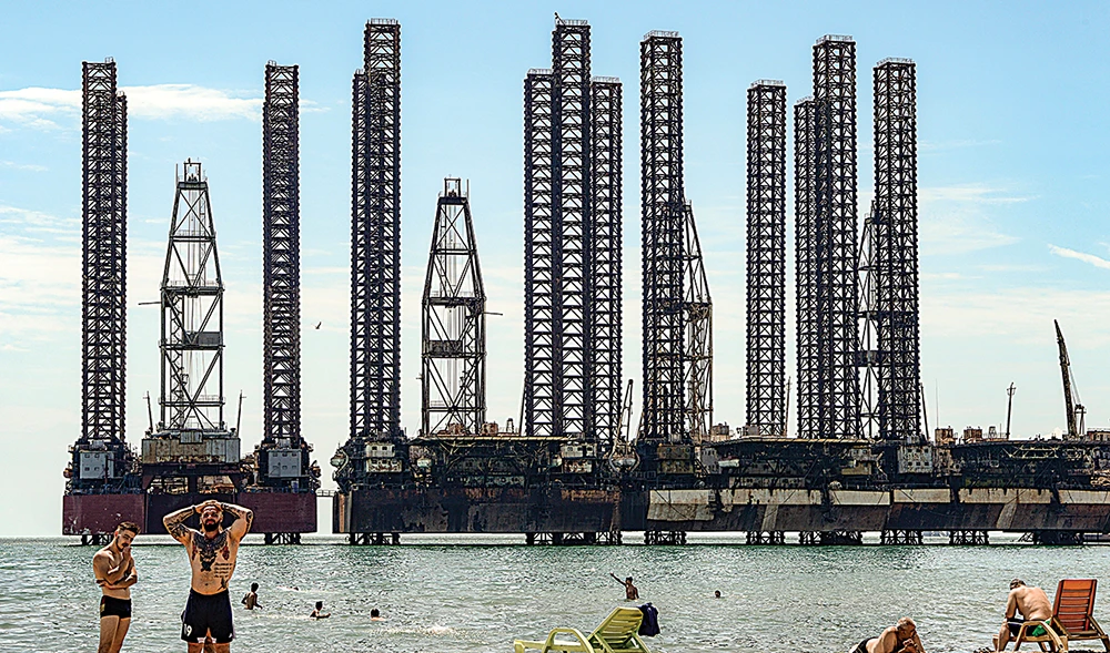 Oil giants’ production cuts come to 1m bpd as they post massive write-downs