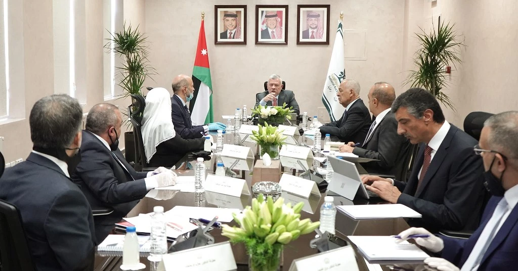 King Abdullah II, center, has been leading the Jordanian government in dealing with the coronavirus pandemic. (Jordanian Royal Palace via AFP)